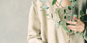 Lady hiding behing a plant